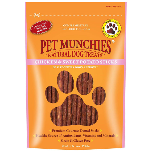 Packaging of PET MUNCHIES dog treats, featuring an image of a dog's paw and pieces of chicken and sweet potato stick.