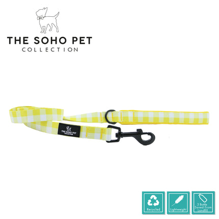 Yellow and white checkered dog leash with black clip on a white background, featuring 'The Soho Pet Collection' branding.